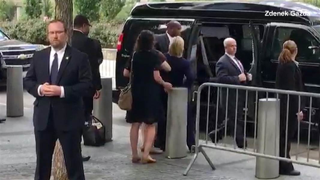 Hillary Clinton Feels 'Overheated' at 9/11 Memorial in N.Y. She is shown being ushered into her ambulance van.