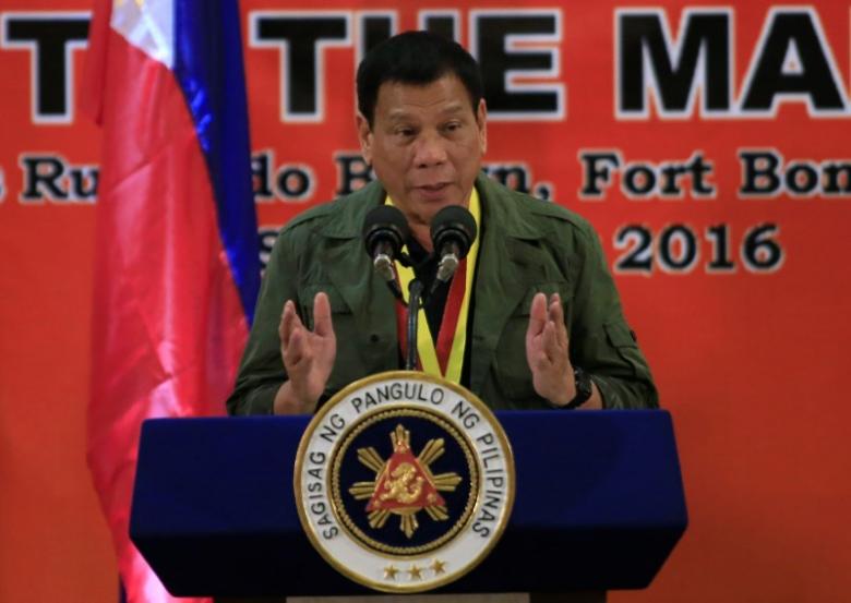 Philippines President Rodrigo Duterte delivers a speech to members of the Philippine Marines during a visit at the marines headquarters in Taguig city, metro Manila, Philippines September 27, 2016.  REUTERS/Romeo Ranoco